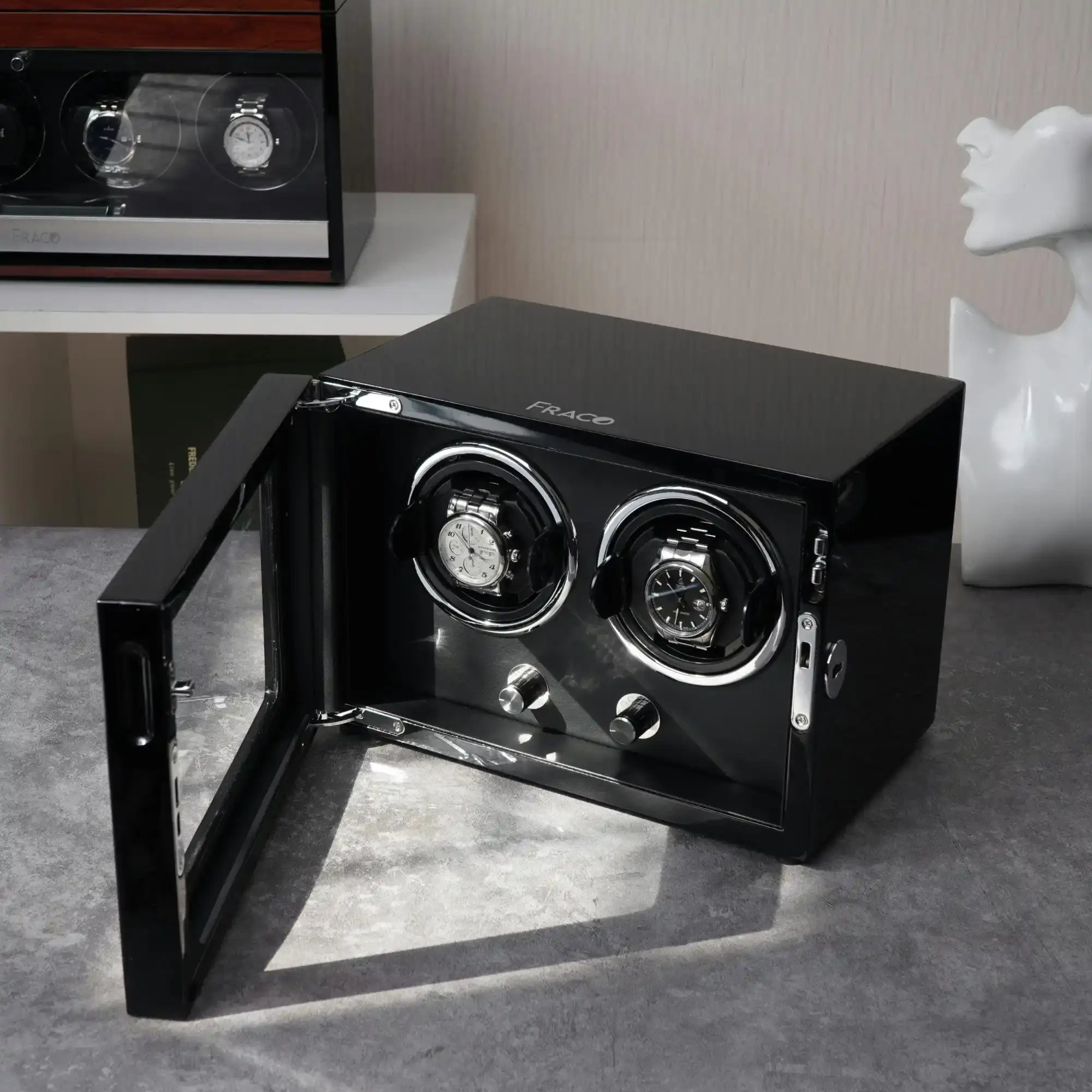 Black watch winder with open door.