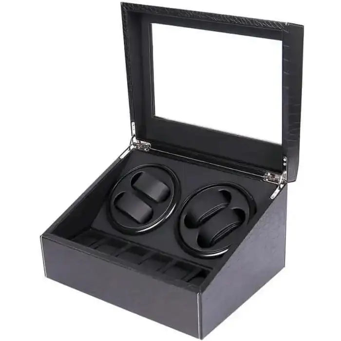 Black leather-wrapped watch winder box with two circular rotating compartments and a clear glass lid.