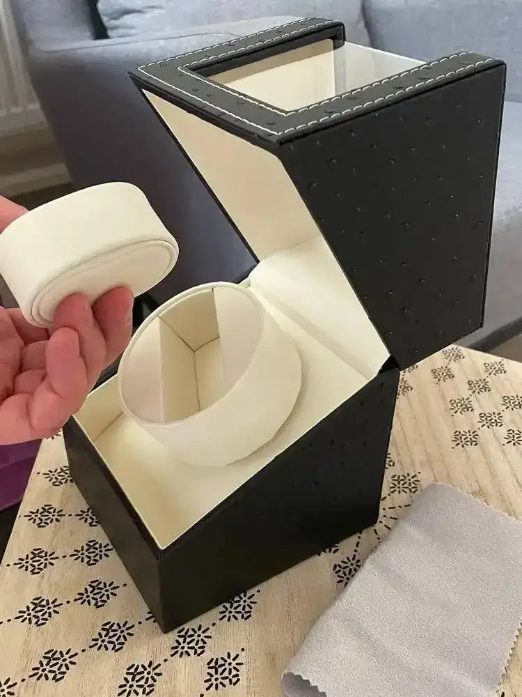 Black leather watch winder.