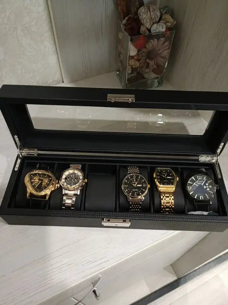 Black watch box with six watches.