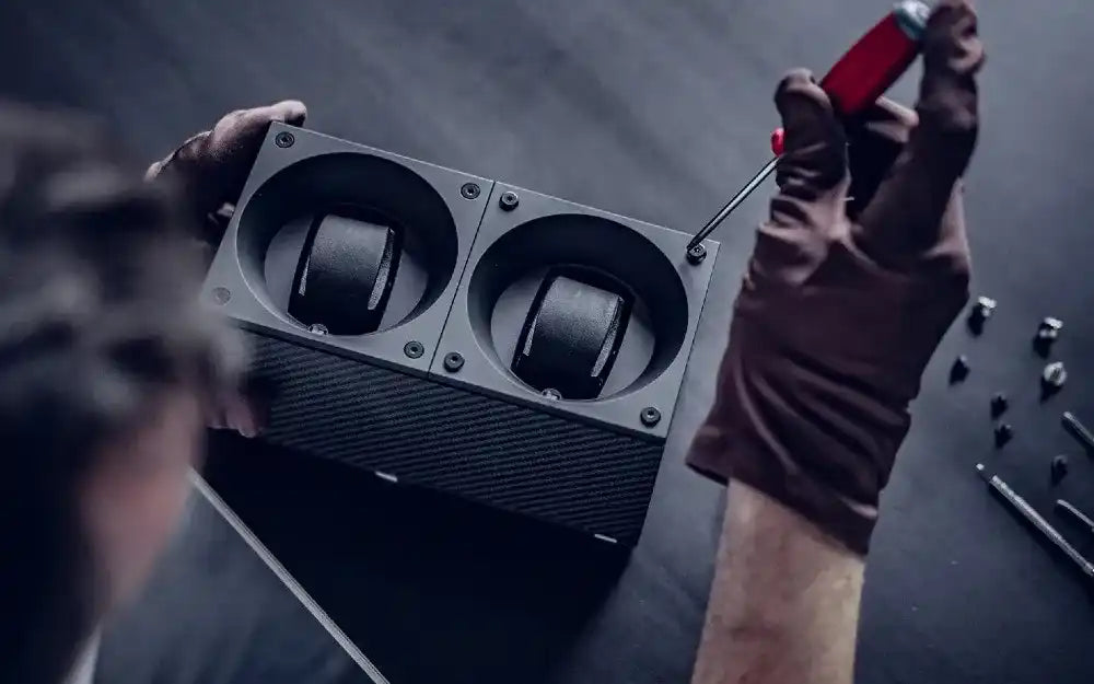 Black watch winder being assembled.