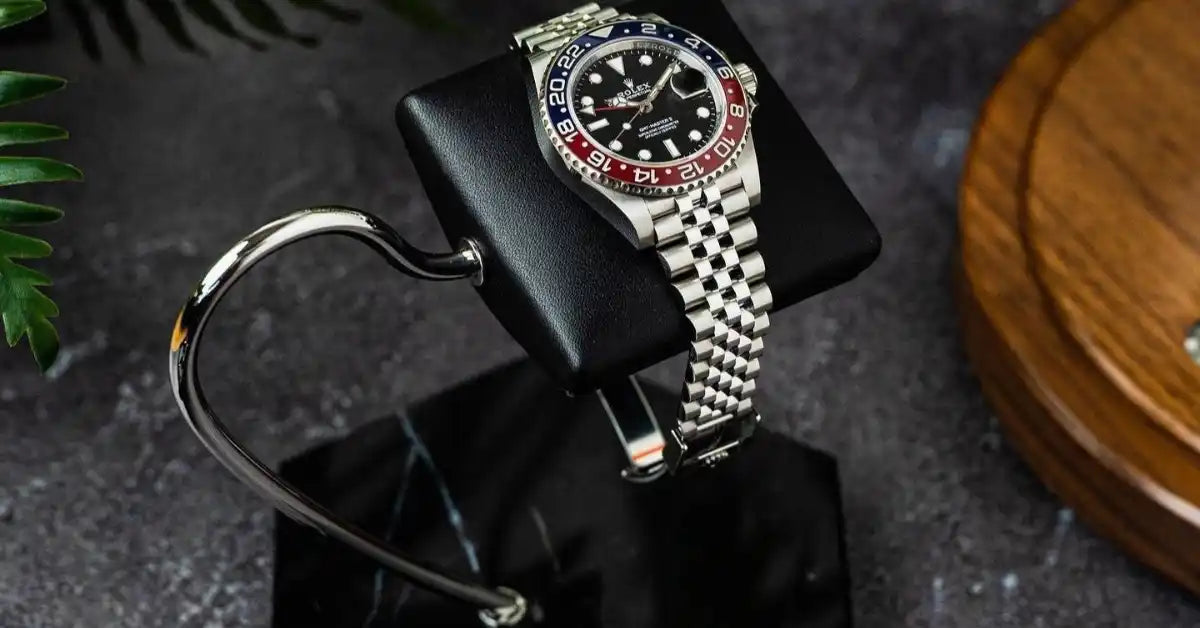 Silver Rolex GMT-Master II watch.