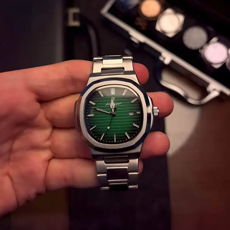 A sleek silver-toned watch with a vibrant green, horizontally striped dial and roman numeral hour markers.